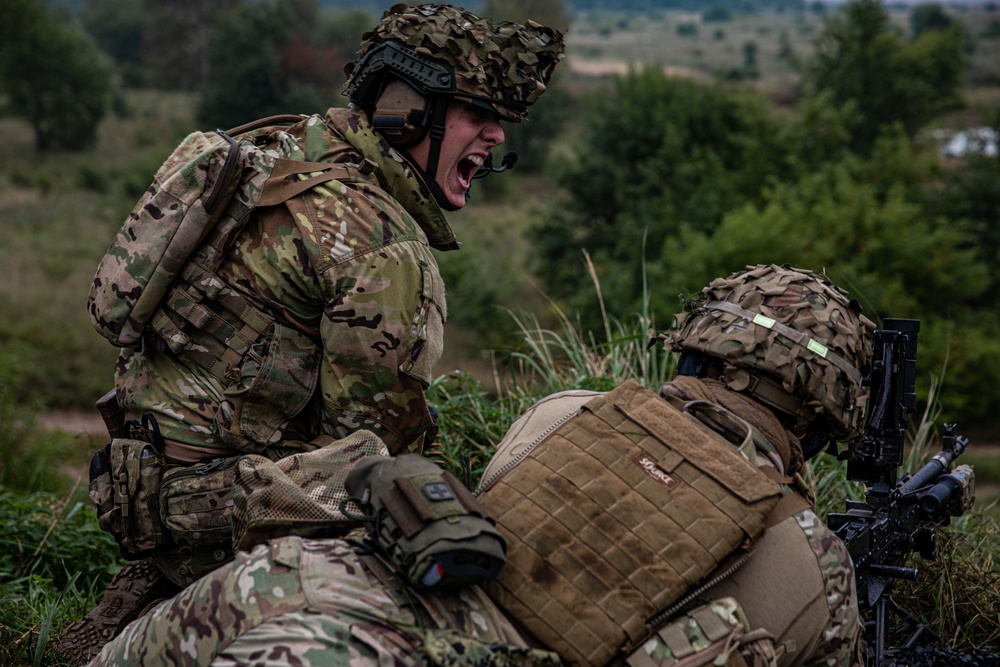 U.S. Army Dark Rifles clear trenches and provide support by fire during training exercise