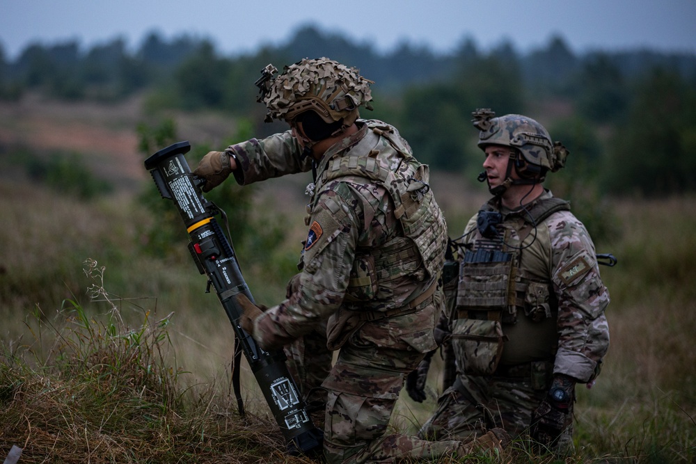 U.S. Army Dark Rifles clear trenches and provide support by fire during training exercise