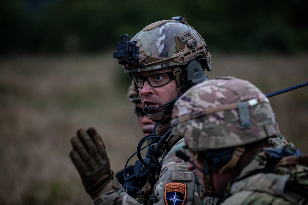 U.S. Army Dark Rifles clear trenches and provide support by fire during training exercise