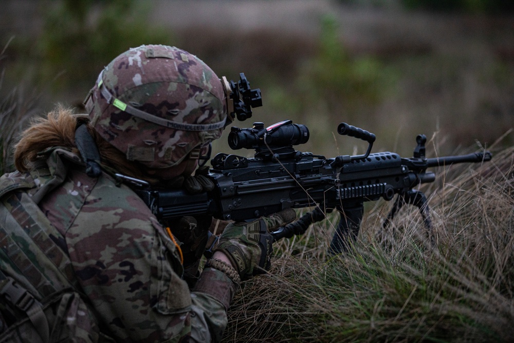 U.S. Army Dark Rifles clear trenches and provide support by fire during training exercise