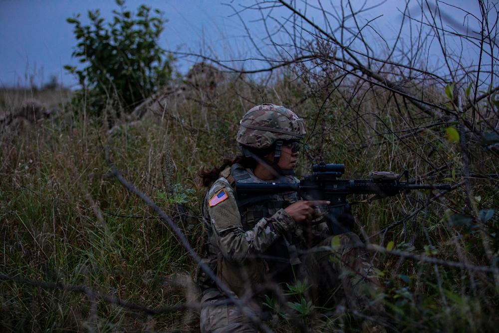 U.S. Army Dark Rifles clear trenches and provide support by fire during training exercise