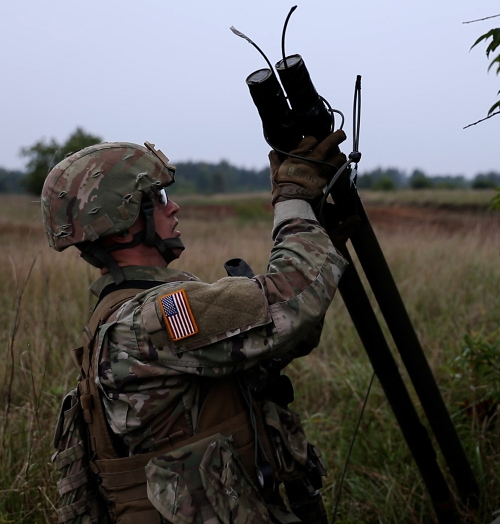 U.S. Army Dark Rifles clear trenches and provide support by fire during training exercise