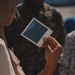 US Marines take Polaroid photos with Afghan Individuals on Fort Pickett