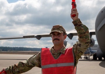 A Reservist Marshaling C-17 Globemaster III