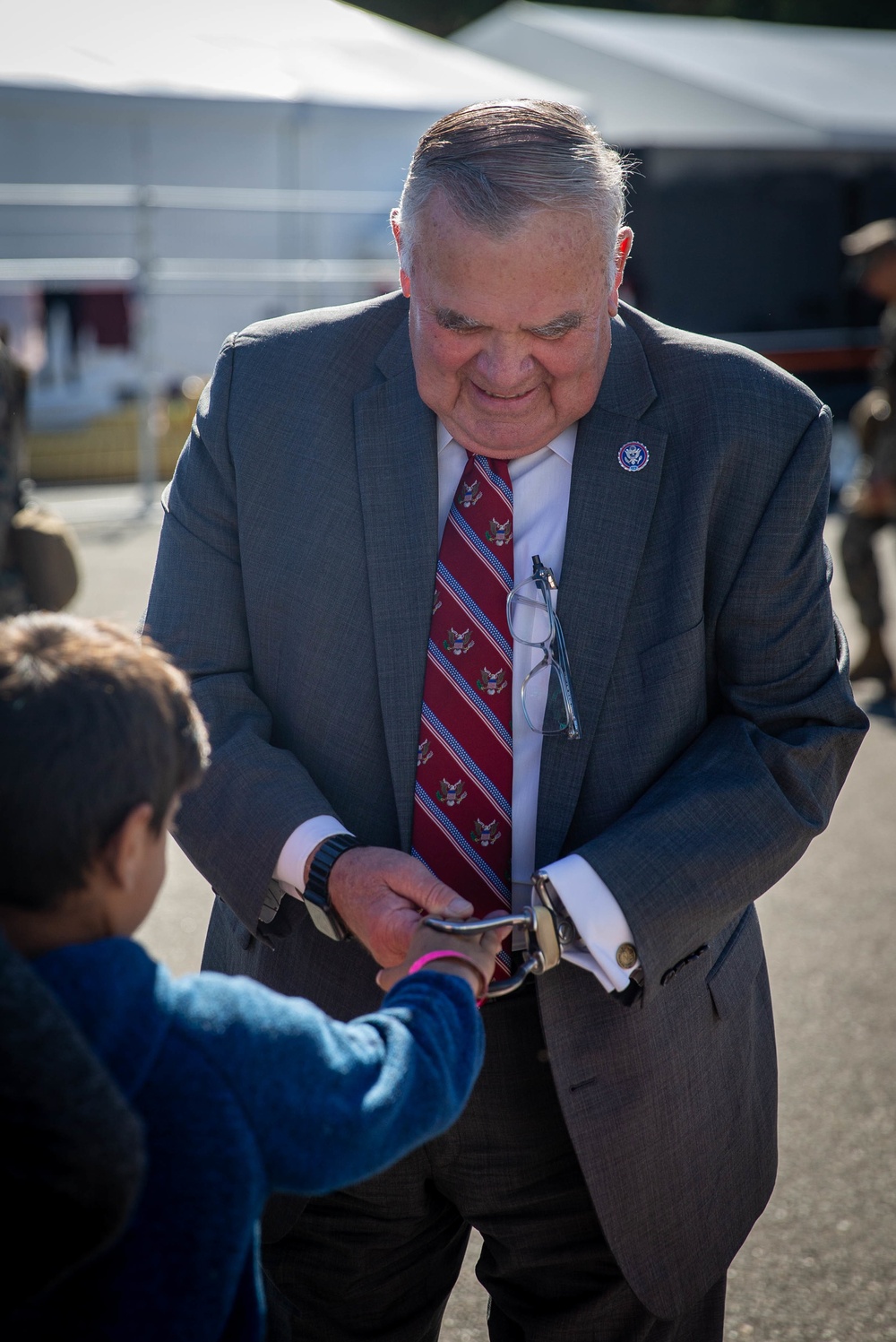 U.S. Congressman Jim Baird interacts with an Afghan child on Task Force Quantico