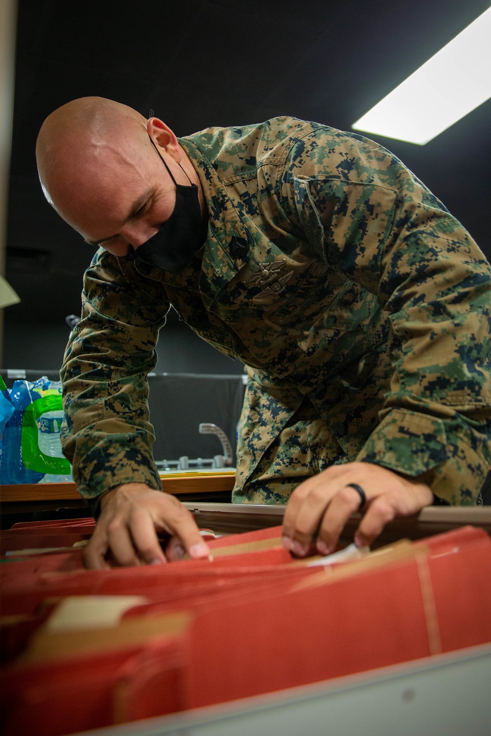 U.S. Navy Corpsmen organize Afghan medical files on Task Force Quantico
