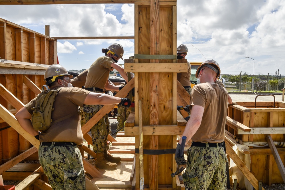 US Navy Seabees assigned to Naval Mobile Construction Battalion 5 build framework to support III Marine Expeditionary Force and 9th Engineer Support Battalion