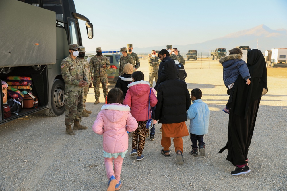 Afghan Travelers prepare to board a flight bound for the United States