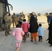 Afghan Travelers prepare to board a flight bound for the United States