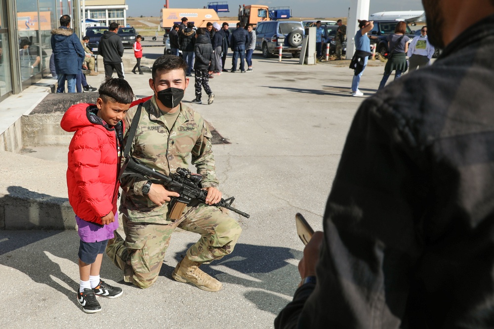 Afghan Travelers prepare to board a flight bound for the United States