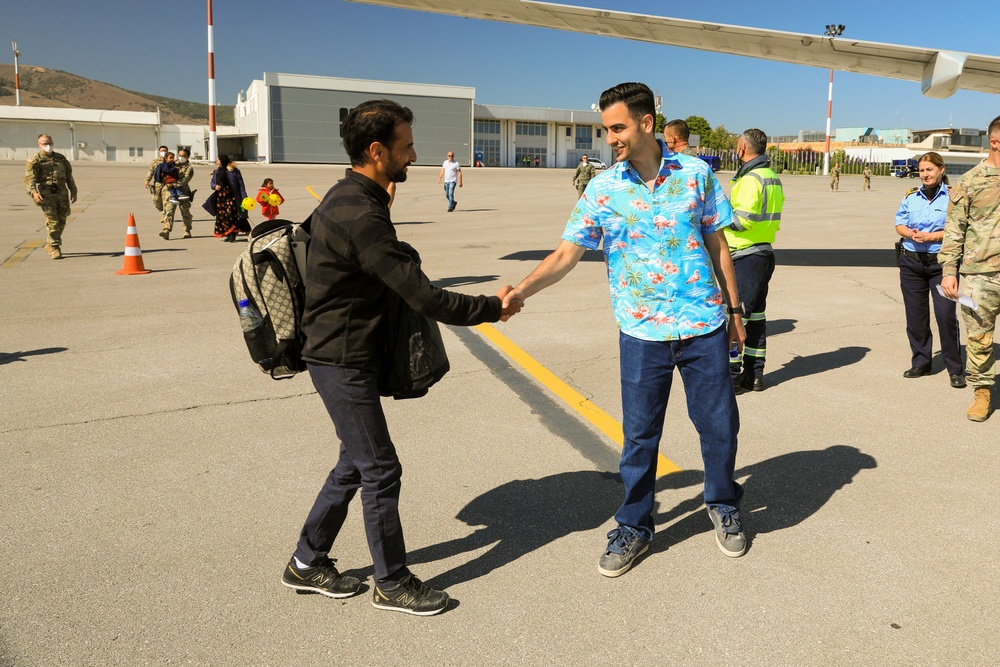 Afghan Travelers prepare to board a flight bound for the United States