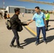 Afghan Travelers prepare to board a flight bound for the United States