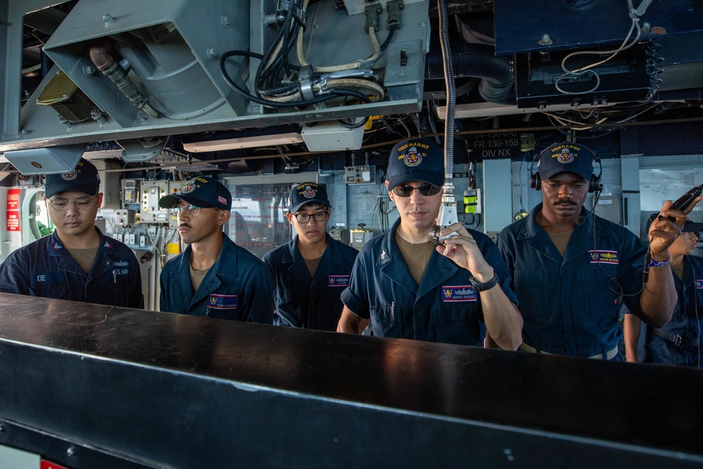 Sailors aboard the USS Barry Stand Watch in the Pilot House during a Replenishment-at-sea with USNS Tippecanoe