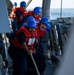 Sailors aboard the USS Barry Heave a Line during a Replenishment-at-sea with USNS Tippecanoe