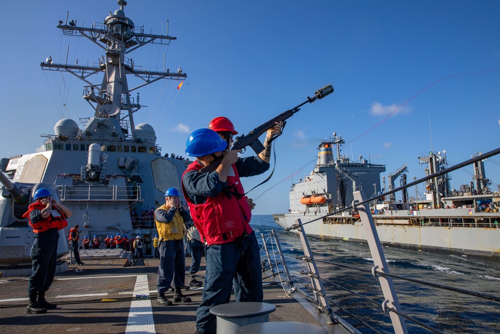 GM3 Mario Herrera Fires a Shot Line from the USS Barry to the USNS Tippecanoe