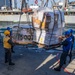 Sailors aboard the USS Barry Receive Pallets of Supplies from the USNS Tippecanoe