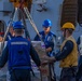 Sailors aboard the USS Barry Receive Pallets of Supplies from the USNS Tippecanoe