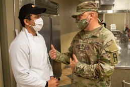 Soldiers serve up food to Afghan evacuee families at Fort McCoy dining facilities