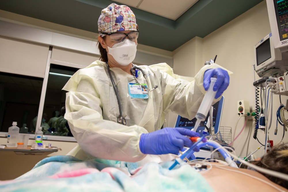 U.S. Army Medical Response Team Member Provides Care to COVID Positive Patients