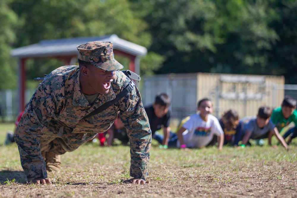 Marines Lead Afghan Children in Recreational Exercise at TF Quantico