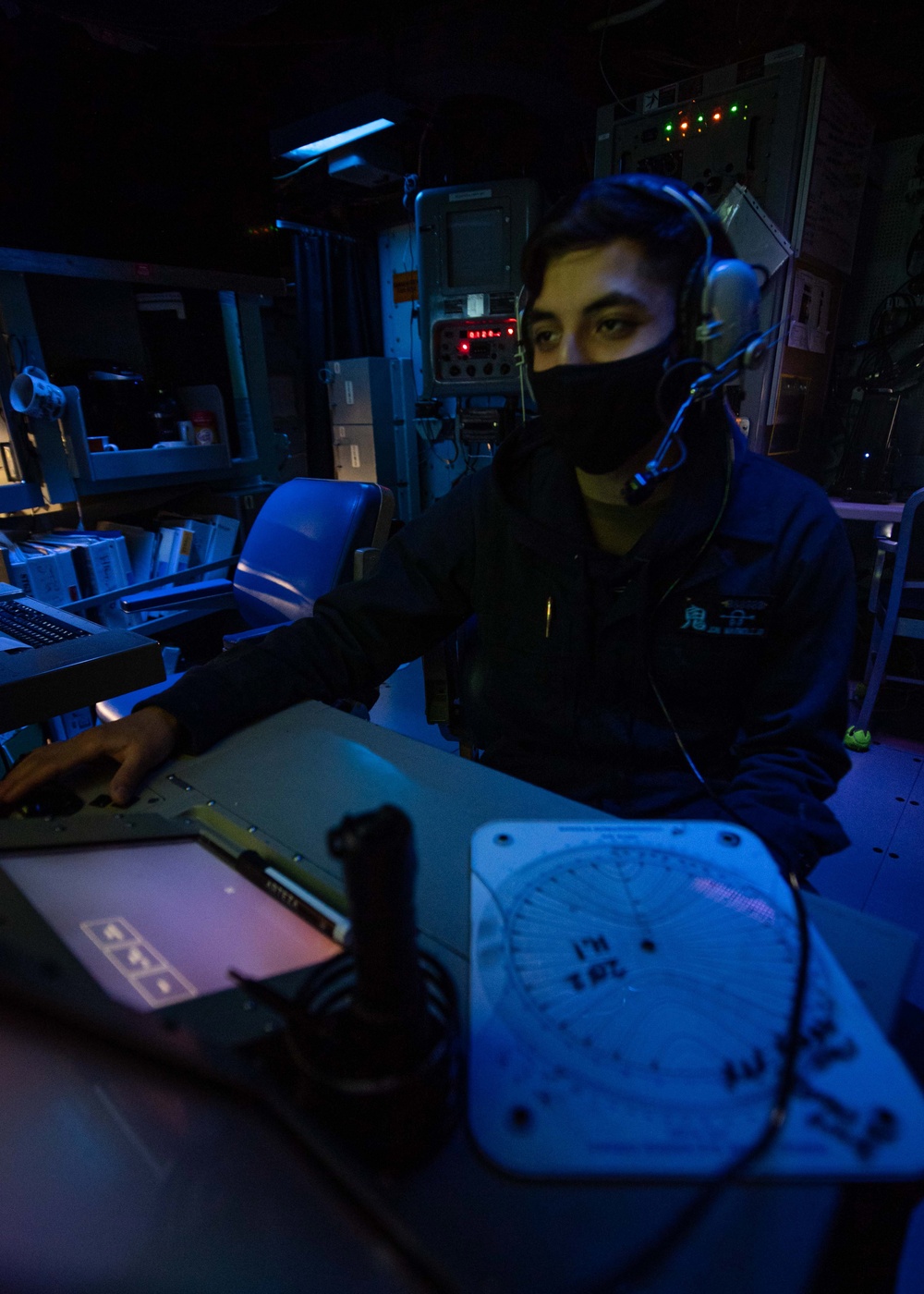 USS Mustin Sailor Monitors Submarine Contacts in Sonar Control During SIFOREX 2021