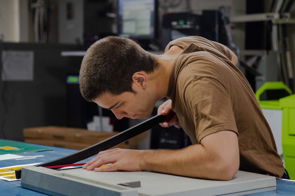 USS Carl Vinson (CVN 70) Sailor Works in Print Shop