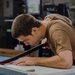 USS Carl Vinson (CVN 70) Sailor Works in Print Shop