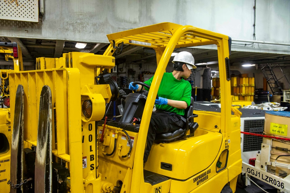 USS Carl Vinson (CVN 70) Sailor Performs Maintenance