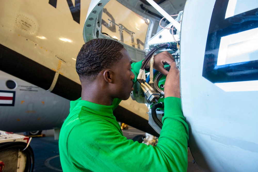 USS Carl Vinson (CVN 70) Sailor Conducts Maintenance in the Hangar Bay