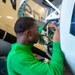 USS Carl Vinson (CVN 70) Sailor Conducts Maintenance in the Hangar Bay