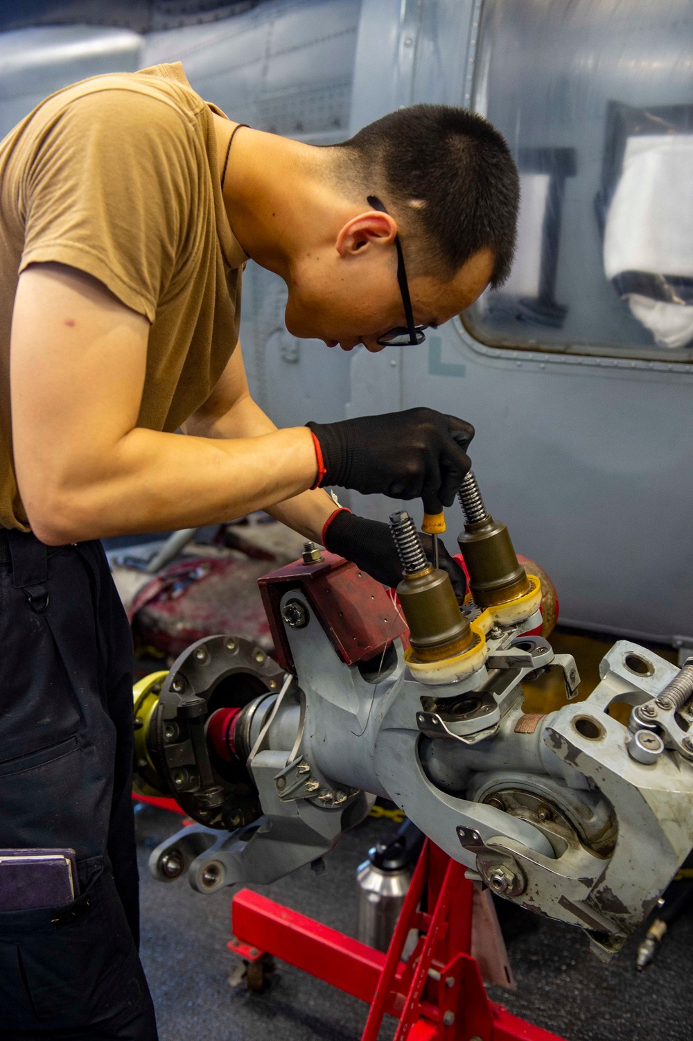 USS Carl Vinson (CVN 70) Sailor Performs Maintenance