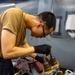 USS Carl Vinson (CVN 70) Sailor Performs Maintenance