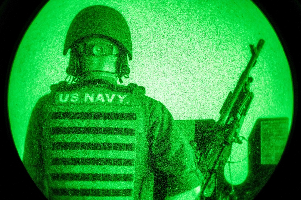 USS Arlington Sailor Mans an M240-B Machine Gun