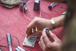 U.S. Army Explosive Ordnance Disposal technicians train with disruption tools