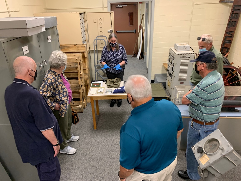 Museum volunteers visit artifact storage facility