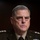 SECDEF, CJCS, CENTCOM Senate Armed Services Testimony A senior U.S. Army officer in dress uniform is seated, appearing to be at a formal hearing or official proceeding. The uniform displays an extensive array of medals, ribbons, badges, and rank insignia consistent with a very high-ranking general officer. The dark background and microphone suggest a congressional testimony or similar official setting.