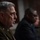 SECDEF, CJCS, CENTCOM Senate Armed Services Testimony A U.S. Army officer in dress uniform is seated at what appears to be a congressional hearing or formal testimony setting. The officer wears an 'Airborne' patch with the 101st Airborne Division screaming eagle insignia on the left shoulder. A second individual in a dark suit is visible but out of focus in the background.