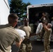 Oklahoma Air National Guardsman unloads donations in Liberty Village