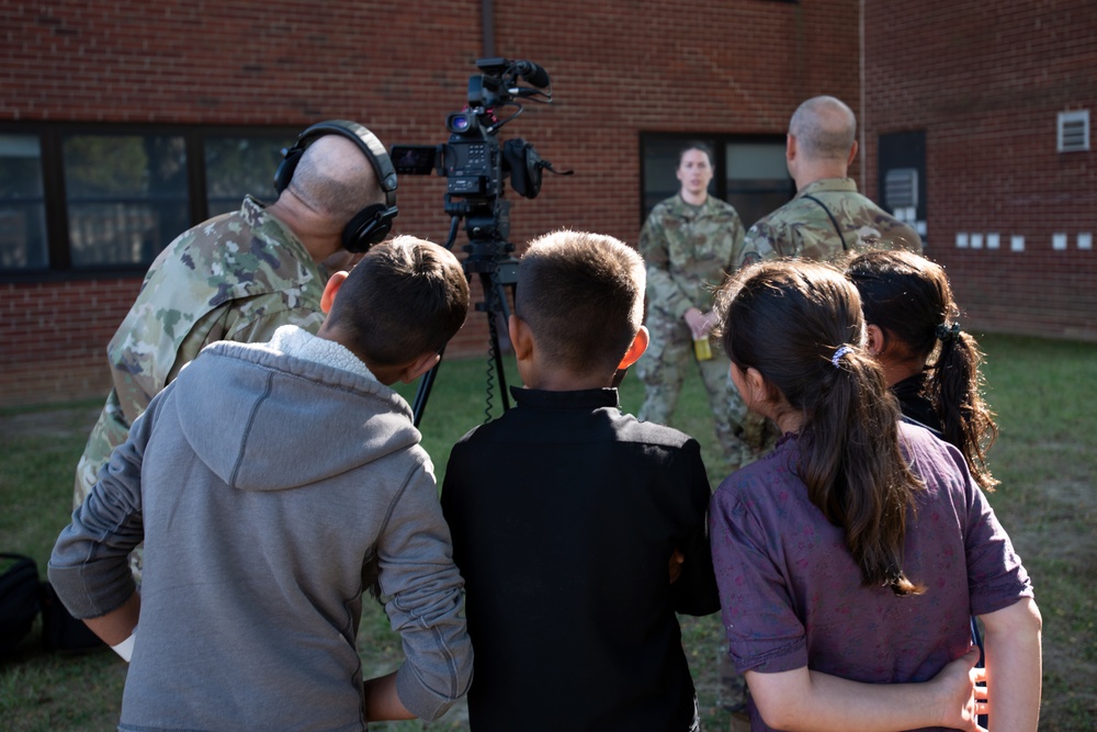Afghan children watch Public Affairs interview