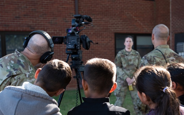 Afghan children watch Public Affairs interview