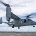 Sailors aboard USS Pearl Harbor guide MV-22B Ospreys from 11th MEU