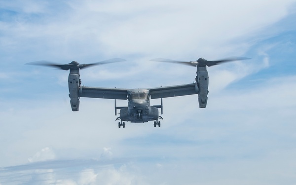 Sailors aboard USS Pearl Harbor guide MV-22B Ospreys from 11th MEU