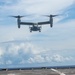 Sailors aboard USS Pearl Harbor guide MV-22B Ospreys from 11th MEU