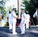 Captain Jason Schneider is congratulated by Commander Melissa Chope