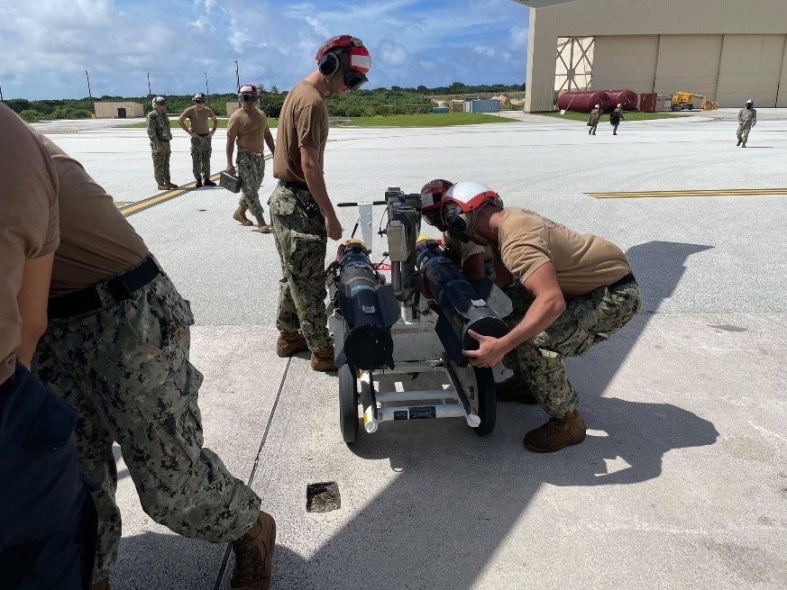 Helicopter Sea Combat Squadron (HSC) 25 prepared to onload a Captive Air Training Missile (CATM) for a firing exercise.