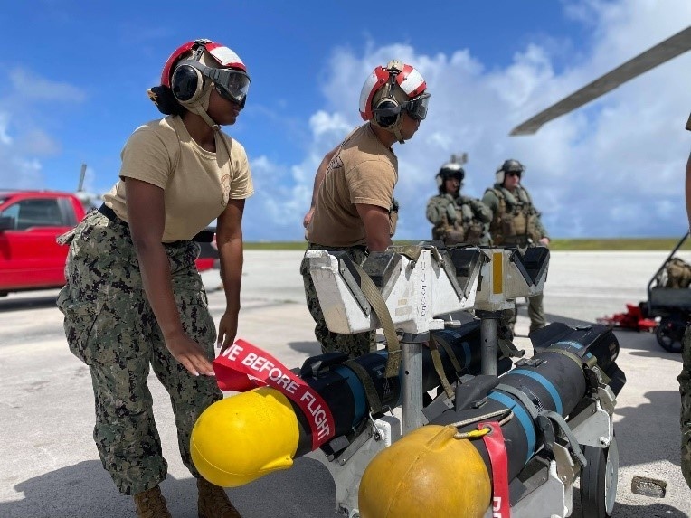 Helicopter Sea Combat Squadron (HSC) 25 prepared to onload a Captive Air Training Missile (CATM) for a firing exercise.