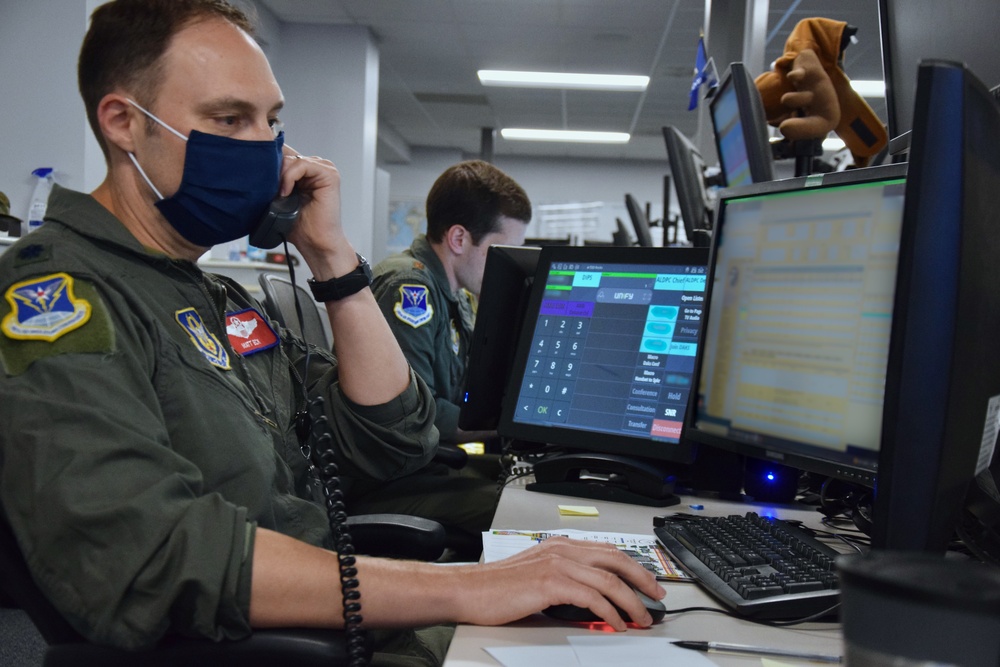 Members of the 618th Air Operations Center provide command and control to military flights participating in the Afghanistan evacuation.