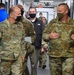 Gen Lyons is briefed by Brig. Gen. DeVoe during a visit to the 618th Air Operations Center.
