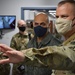 Lt. Gen. Robinson is briefed by Brig. Gen DeVoe during a visit to the AOC.