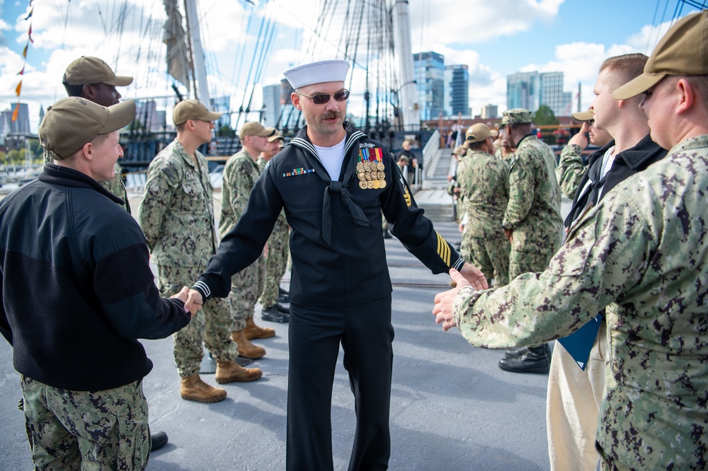 Builder 1st Class Charles Ferguson bids farewell to the officers and crew of Constitution after completing his tour aboard.